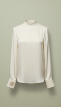 Ivory silk blouse with monogrammed cuff